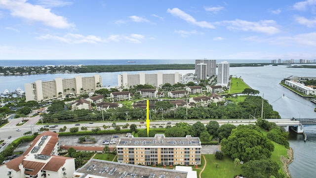 birds eye view of property with a water view