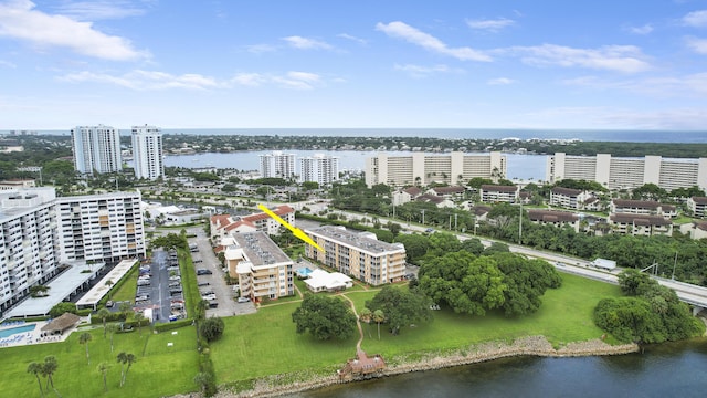 birds eye view of property with a water view