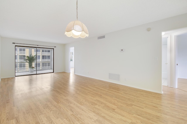 unfurnished room featuring light wood-type flooring