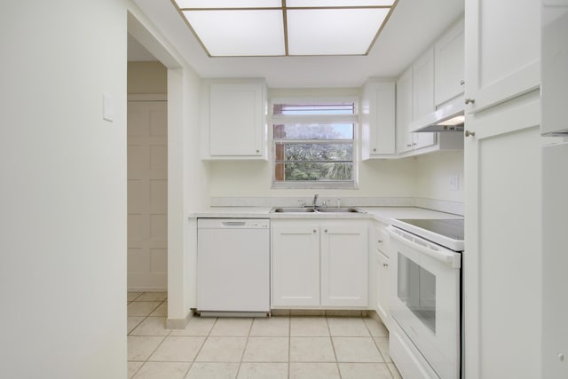 kitchen featuring white cabinets, light tile patterned floors, sink, and white appliances