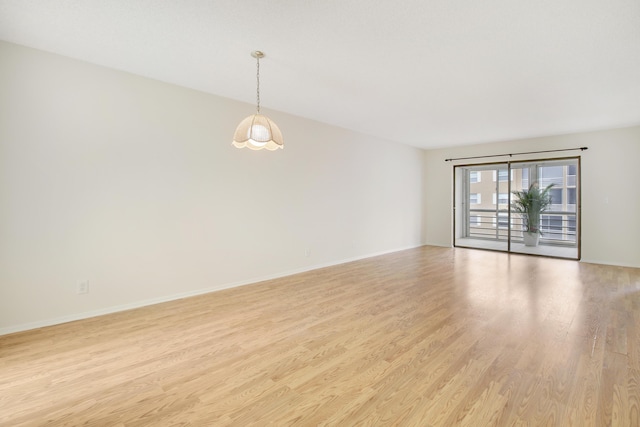 spare room with light hardwood / wood-style flooring