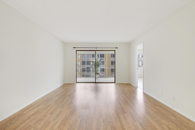 unfurnished room featuring light hardwood / wood-style floors