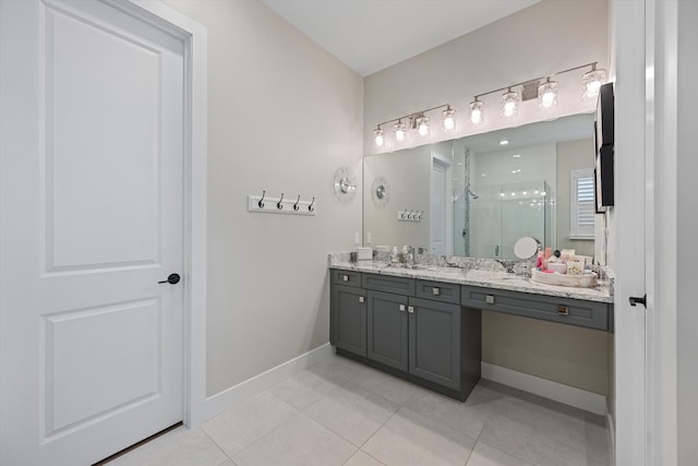 bathroom with tile patterned flooring, vanity, and an enclosed shower