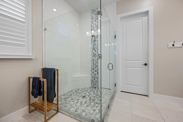 bathroom with tile patterned flooring and an enclosed shower