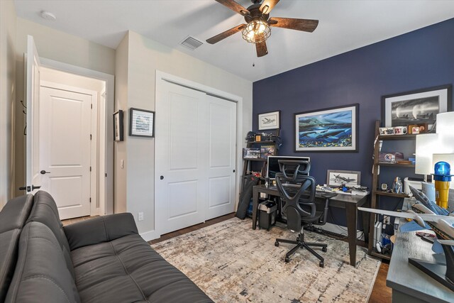 office space with ceiling fan and dark wood-type flooring