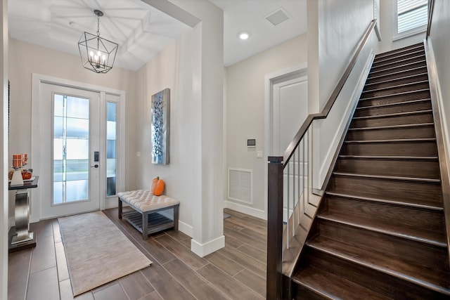 entryway featuring a chandelier