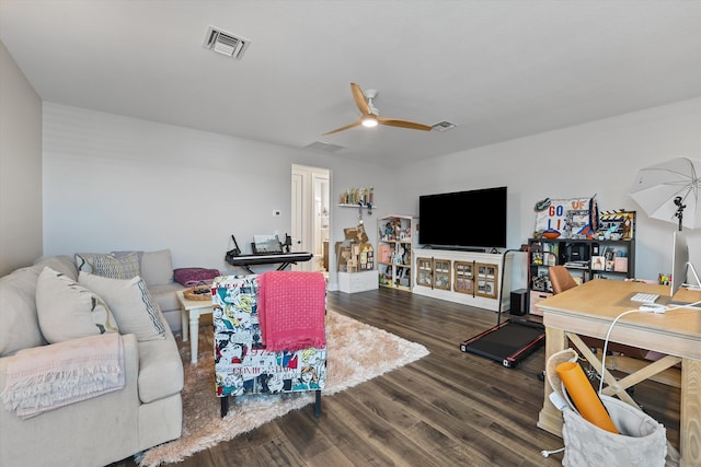 living room featuring ceiling fan and wood-type flooring