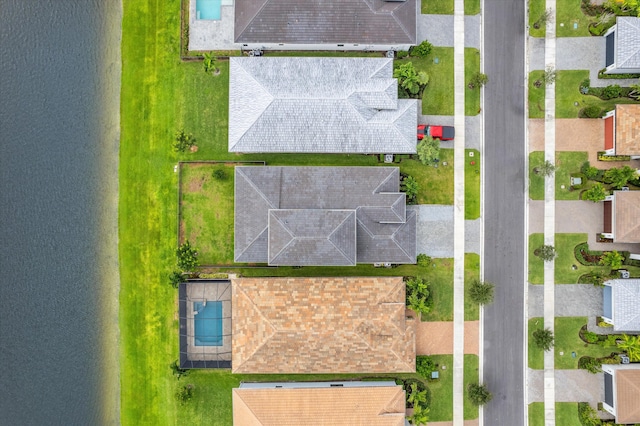 drone / aerial view with a water view