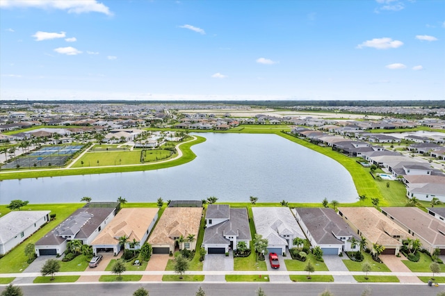 birds eye view of property with a water view