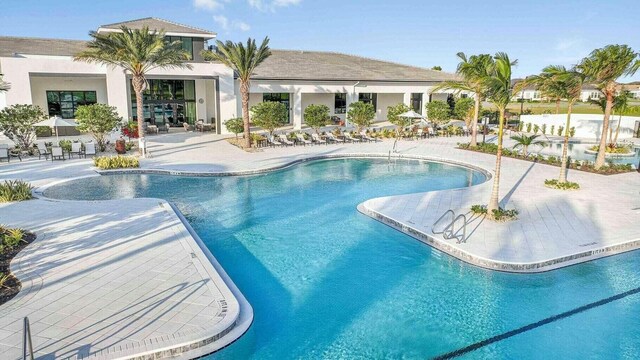 view of swimming pool featuring a patio area