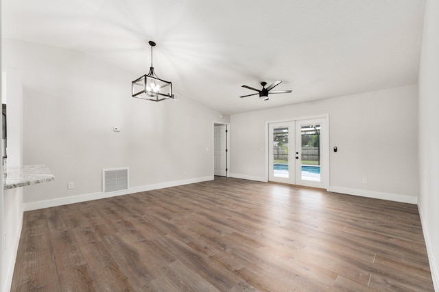 interior space featuring ceiling fan, dark hardwood / wood-style flooring, lofted ceiling, and french doors