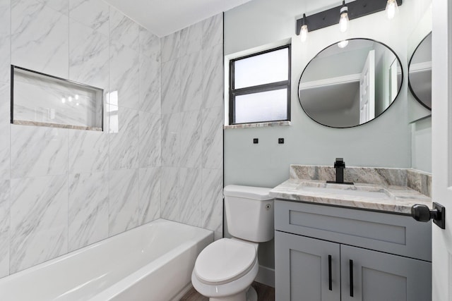 full bathroom with vanity, toilet, and tiled shower / bath combo