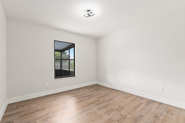 empty room with light hardwood / wood-style floors