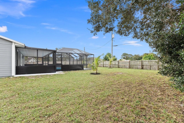 view of yard with a lanai