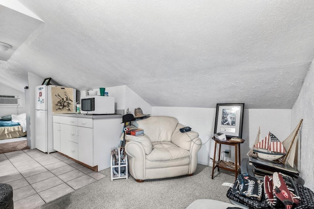 tiled living room featuring lofted ceiling and a wall mounted AC