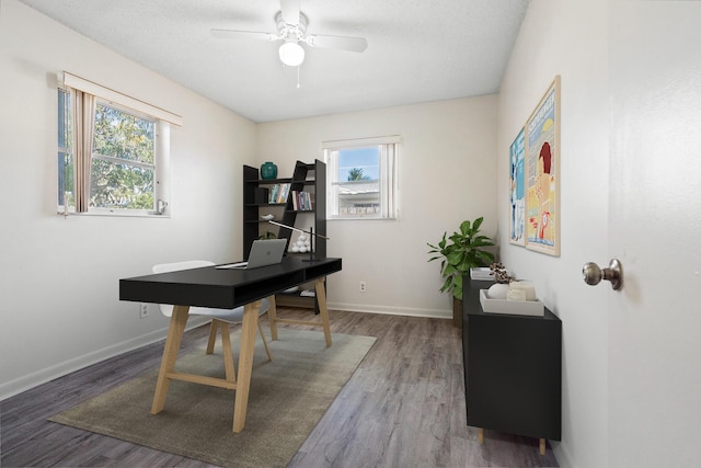 home office featuring hardwood / wood-style floors, plenty of natural light, and ceiling fan