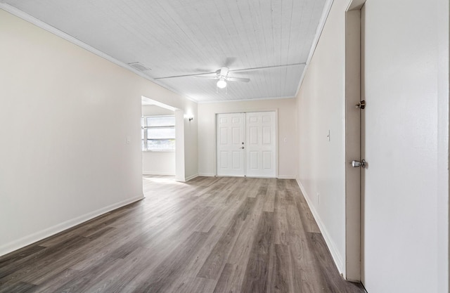 interior space featuring ceiling fan, ornamental molding, and hardwood / wood-style floors