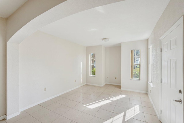 spare room with light tile patterned floors