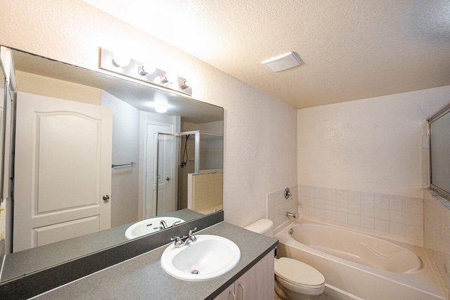 full bathroom featuring vanity, shower with separate bathtub, toilet, and a textured ceiling