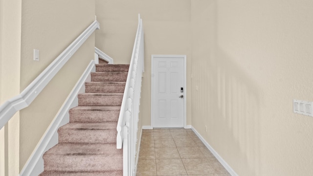 stairs with tile patterned flooring