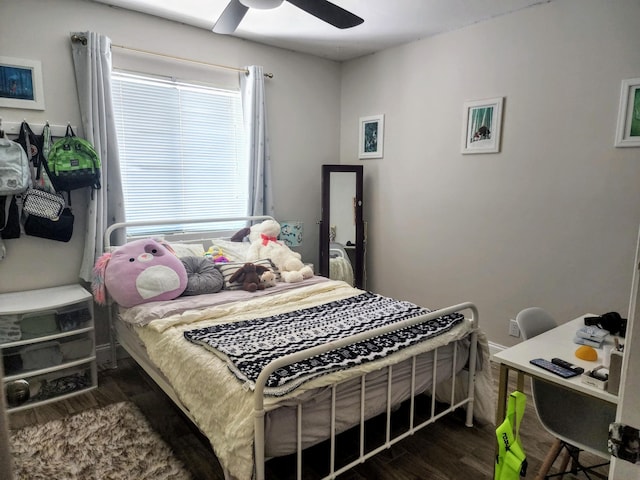 bedroom with ceiling fan and dark hardwood / wood-style floors