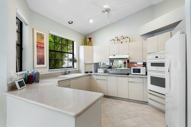 kitchen featuring white cabinetry, ceiling fan, sink, kitchen peninsula, and white appliances