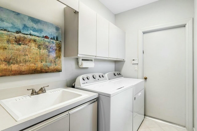 laundry room with cabinets, separate washer and dryer, and sink