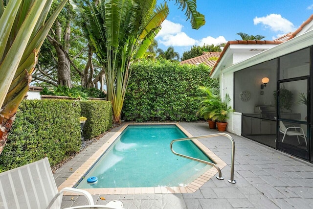 view of pool featuring a sunroom