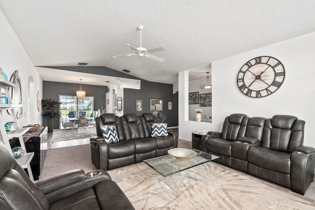 living room with carpet, ceiling fan, lofted ceiling, and a textured ceiling