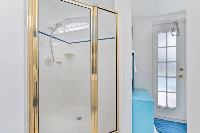 bathroom with a shower with shower door