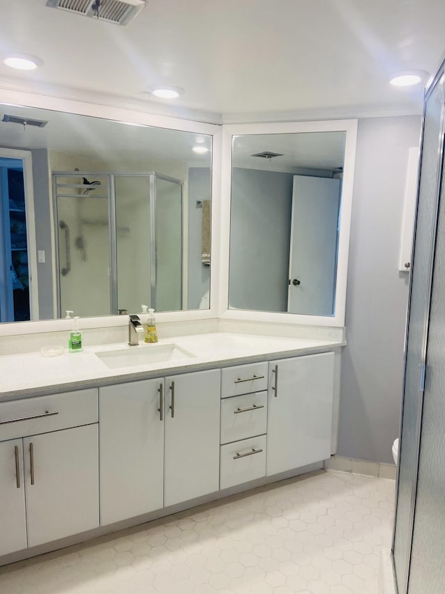 bathroom featuring vanity and walk in shower