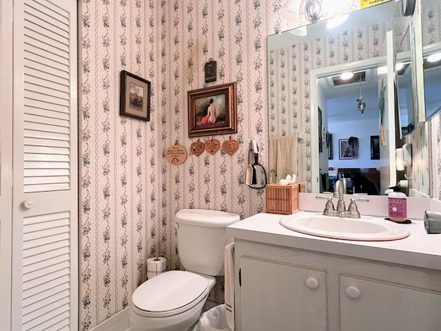 bathroom featuring vanity and toilet