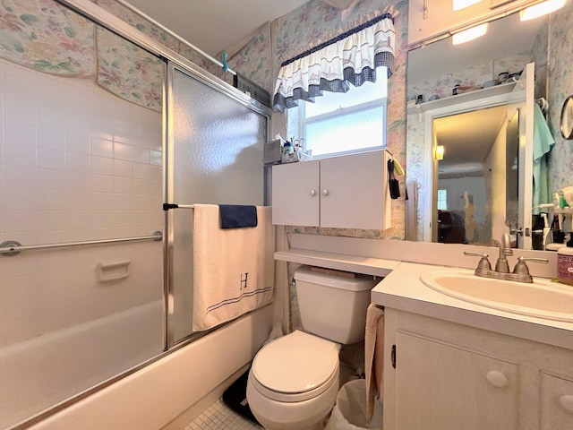 full bathroom with shower / bath combination with glass door, vanity, and toilet