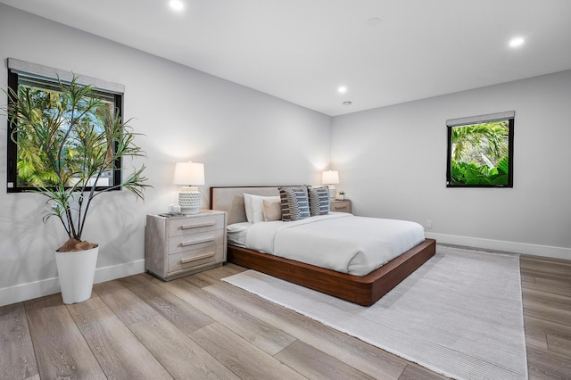 bedroom with light hardwood / wood-style floors