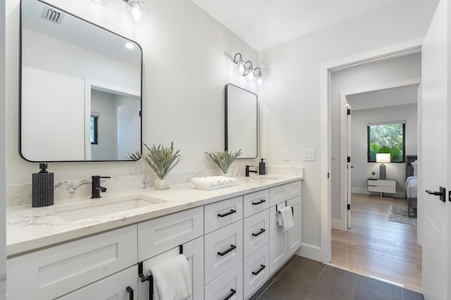 bathroom with hardwood / wood-style flooring and vanity