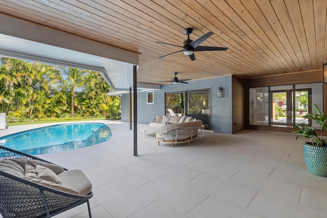 view of swimming pool with ceiling fan, an outdoor hangout area, and a patio area