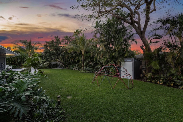 yard at dusk with a shed