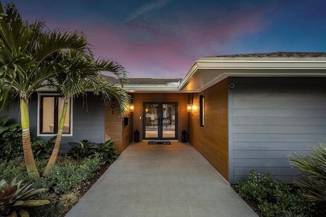 exterior entry at dusk with french doors