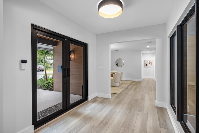 hallway with light wood-type flooring