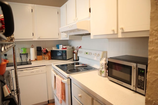 kitchen with white cabinetry and white appliances