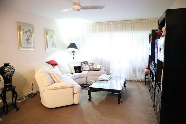 living room featuring carpet flooring, plenty of natural light, and ceiling fan