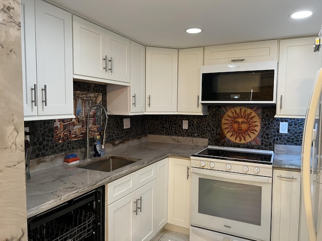 kitchen with white range with electric cooktop, sink, decorative backsplash, white cabinetry, and beverage cooler