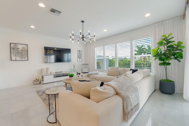 tiled living room with a chandelier