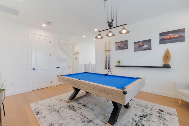 recreation room with light hardwood / wood-style floors and pool table