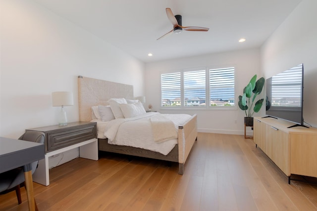 bedroom featuring ceiling fan and light hardwood / wood-style flooring