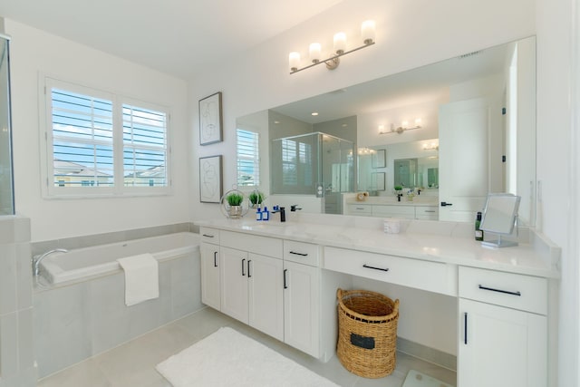 bathroom with plus walk in shower, vanity, and tile patterned floors