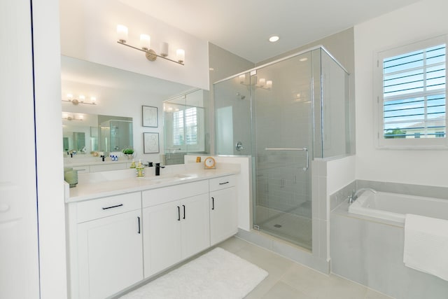 bathroom featuring tile patterned flooring, vanity, and independent shower and bath