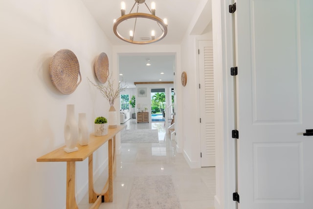 corridor with a chandelier