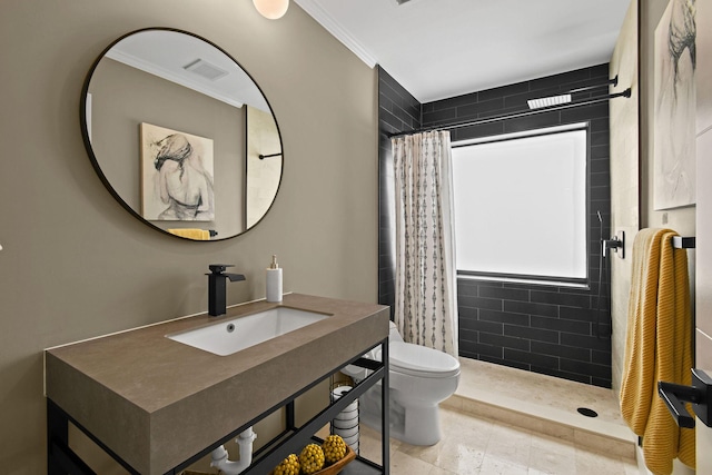 bathroom with a shower with curtain, toilet, ornamental molding, and sink