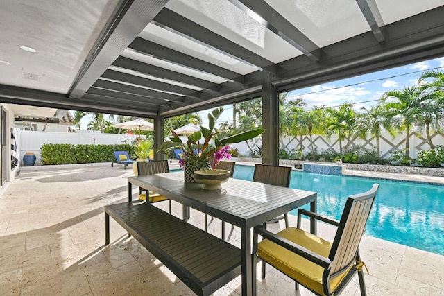 view of patio with pool water feature and a fenced in pool